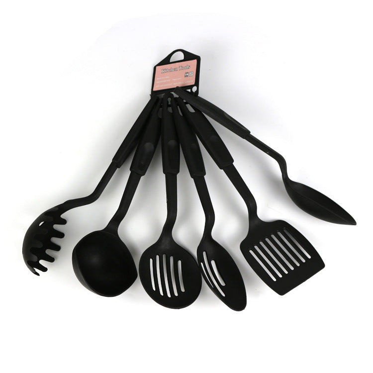 Zamora Mart kitchen set with pots, pans, utensils, and cookware arranged on a countertop for cooking and meal prep.