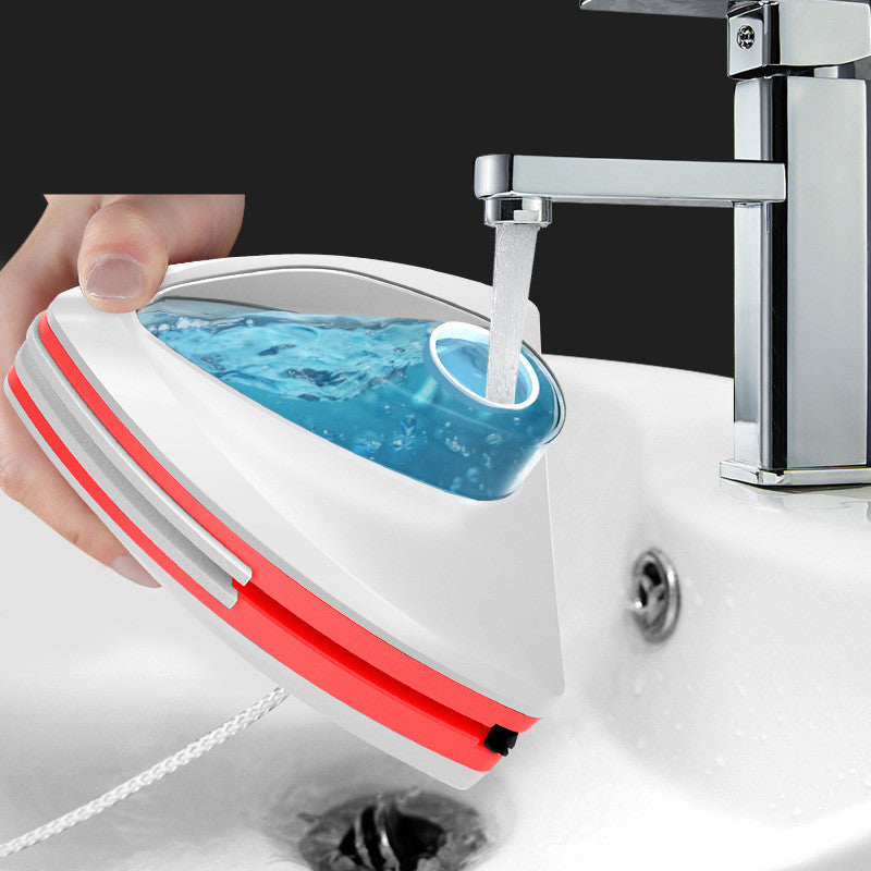 ZAMORA MART magnetic glass cleaner with dual magnetic cleaning heads on clear glass surface for streak-free shine.