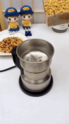 Steel electric grinder by ZAMORA MART with a sleek design, suitable for grinding spices, coffee, or herbs in the kitchen.