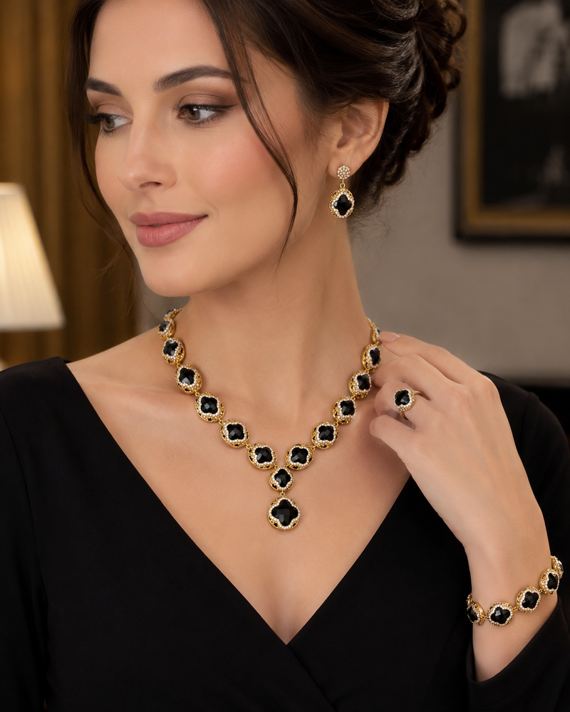 Elegant jewelry set by ZAMORA MART featuring coordinated necklace, earrings, and bracelet with intricate design.