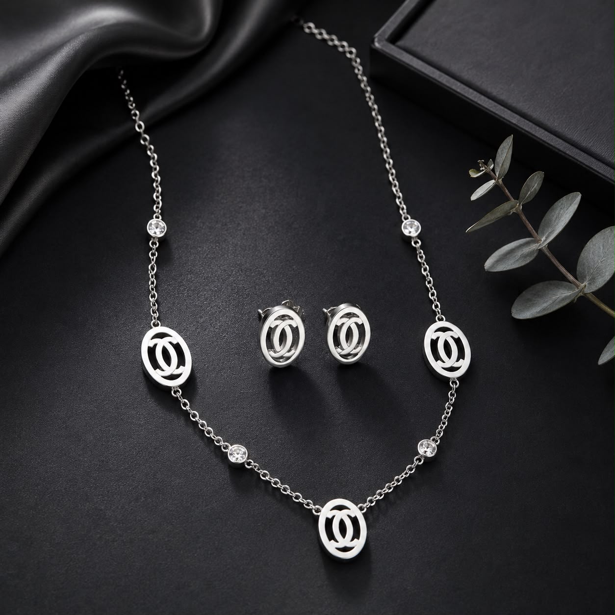 Silver geometric jewelry piece by ZAMORA MART featuring modern, angular design and sleek silver finish.