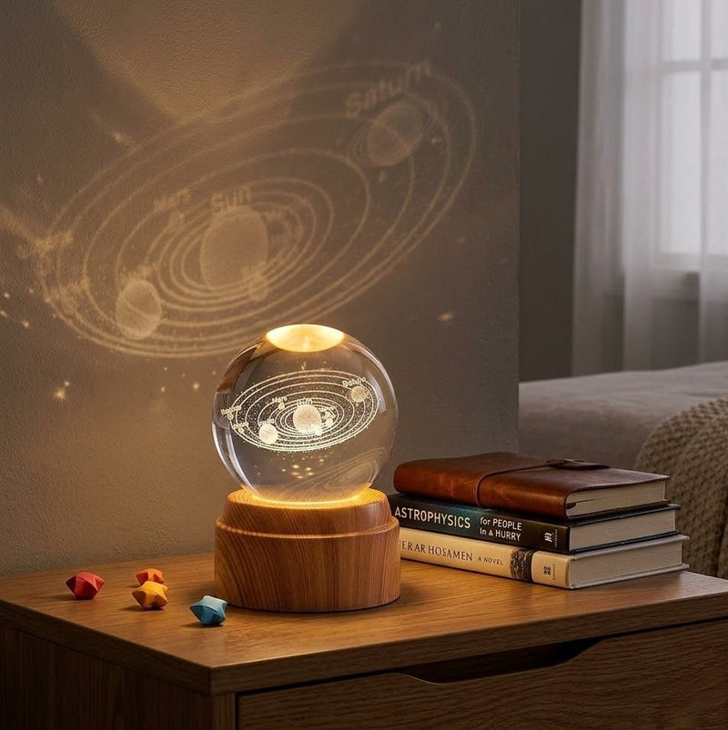 ZAMORA MART crystal ball night light glowing softly with a transparent glass sphere and LED illumination on a dark background.