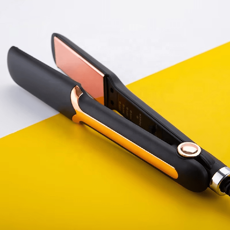 ZAMORA MART Glam Iron hair straightener with ceramic plates, black and silver design, for sleek, straight hair.
