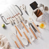 Zamora Mart kitchen set with pots, pans, utensils, and cutting boards arranged on a countertop for cooking and meal prep.