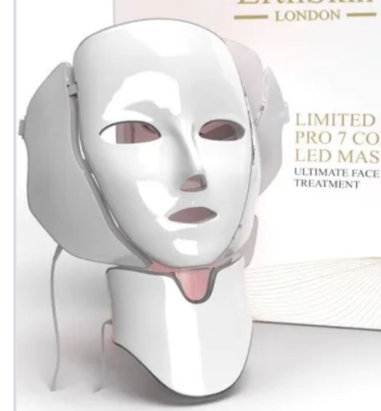 ZAMORA MART LED Photon Rejuvenation Face Mask resting on a white surface, showing its sleek design and multiple LED light panels.
