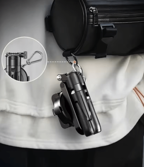 ZAMORA MART mini phone tripod and selfie stick holding a smartphone, compact and portable for selfies and video recording.