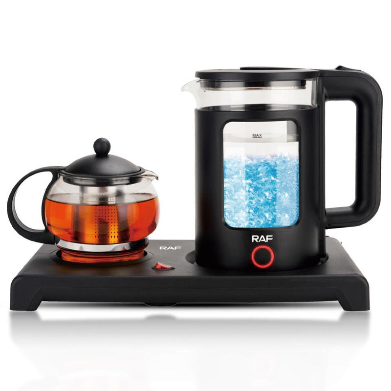 ZAMORA MART electric kettle with stainless steel body, boiling water on a kitchen countertop.