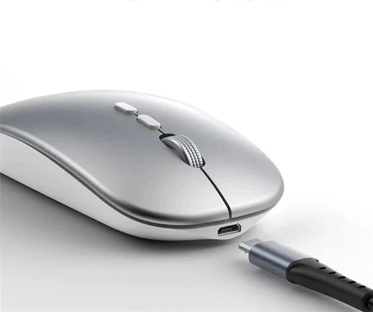 Wireless photoelectric mouse by ZAMORA MART with ergonomic design, black finish, and USB receiver on a desk.